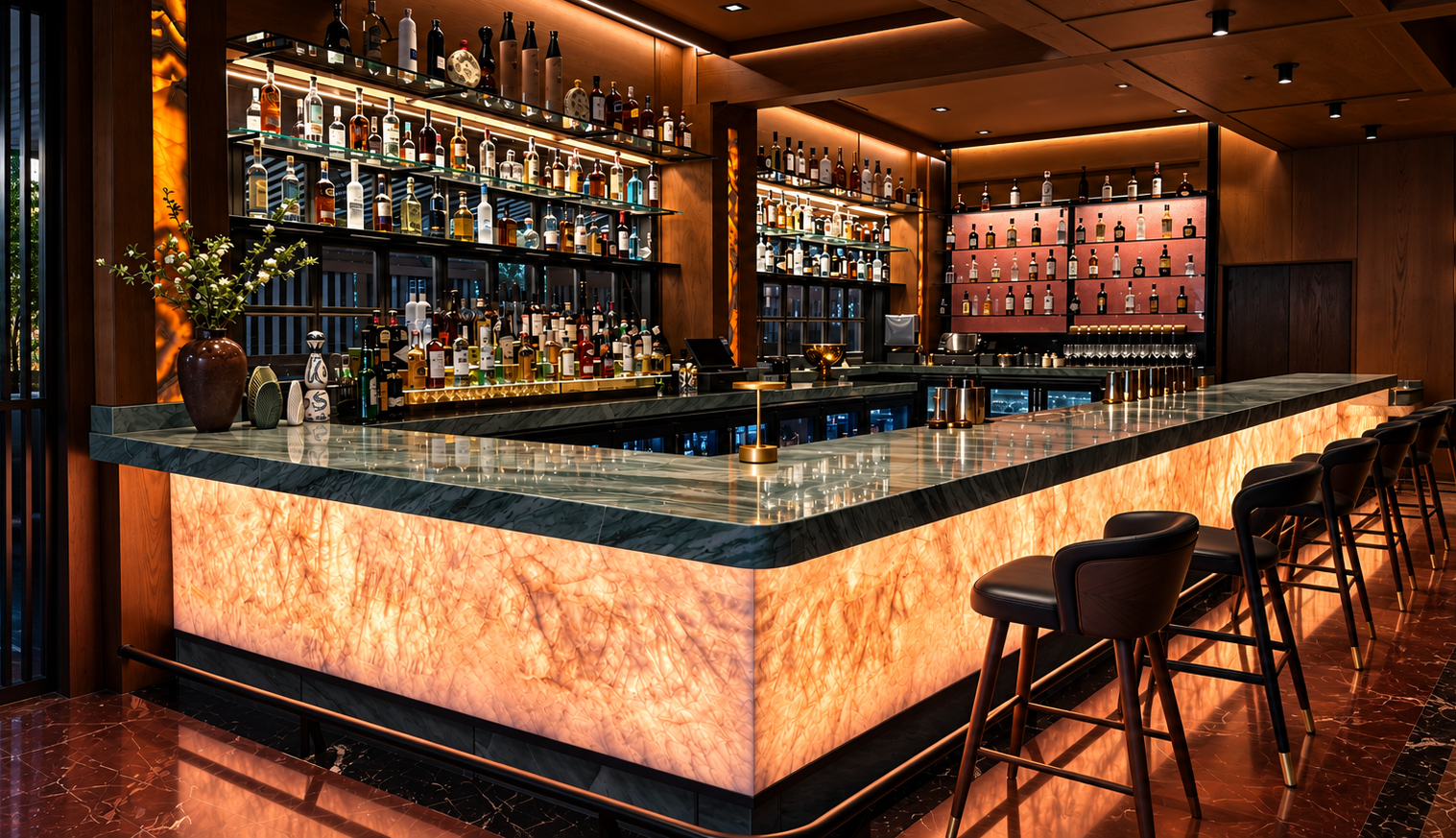 The Social bar with backlit bottles and warm gold lighting