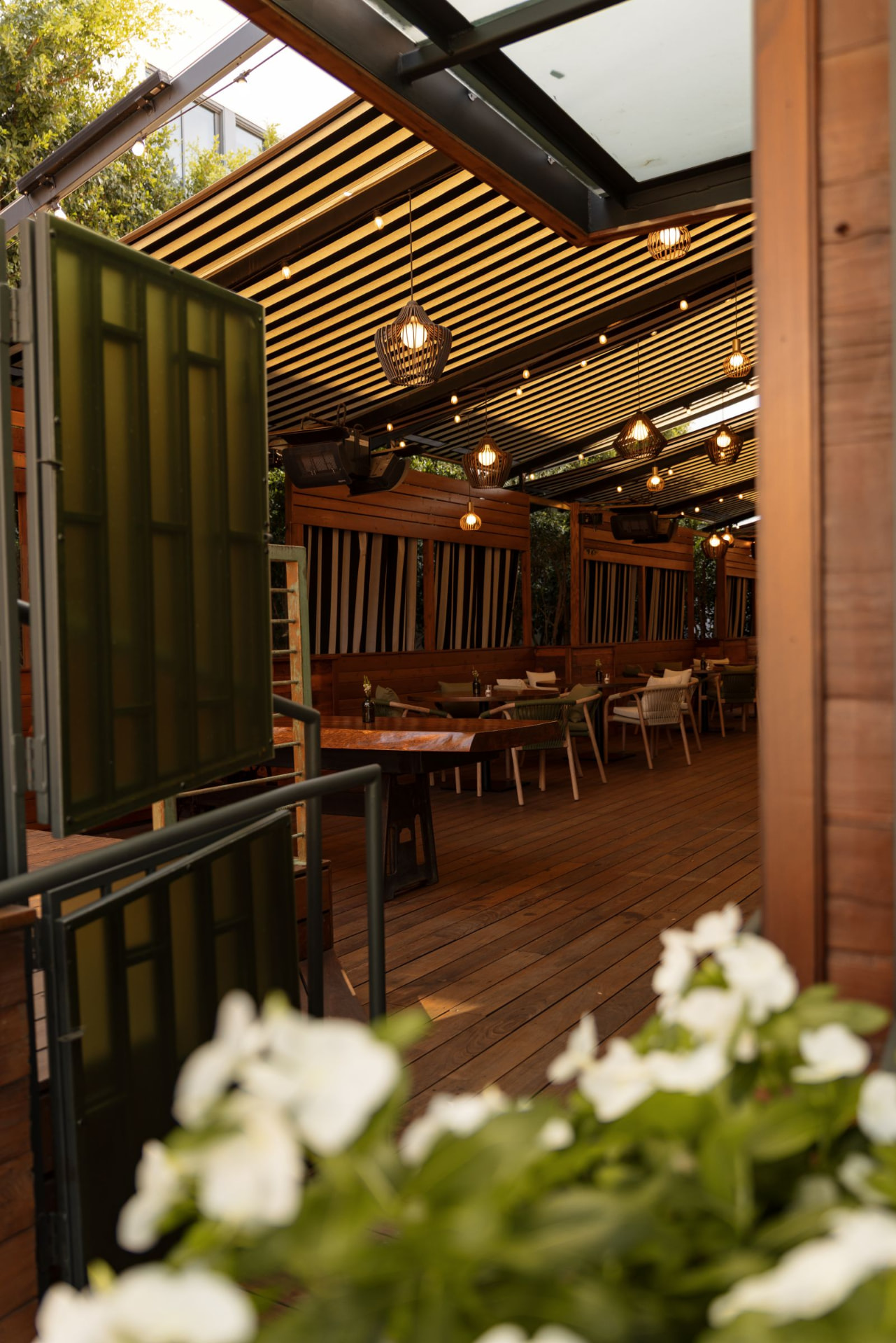 The covered patio at The Social, set for the evening